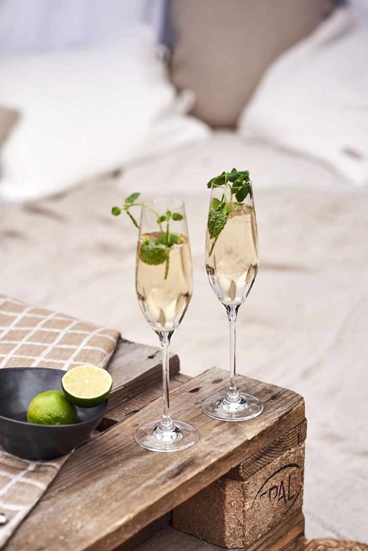 Try a simple summer cocktail recipe this summer - Here you see Prosecco with elderflower and mint served in the Karlevi champagne flute from Scandi Living