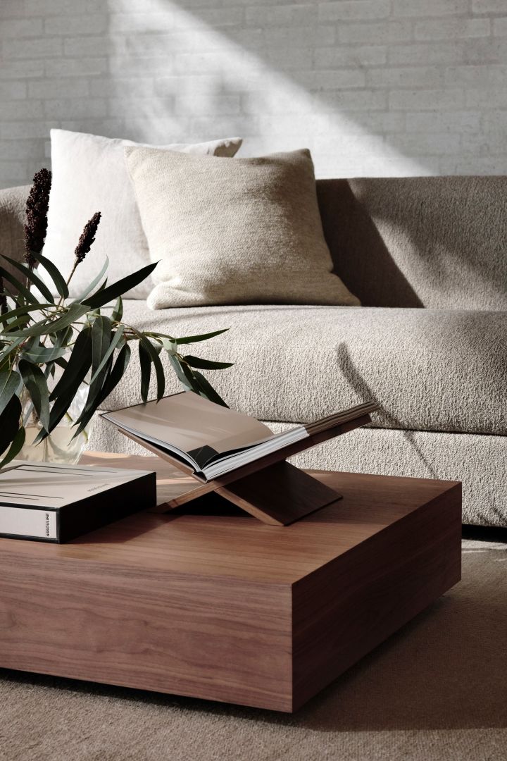 Walnut and dark woods are a big part of this year's interior design trends. Here, the Mass Wide walnut coffee table from New Works in a neutral living room. 