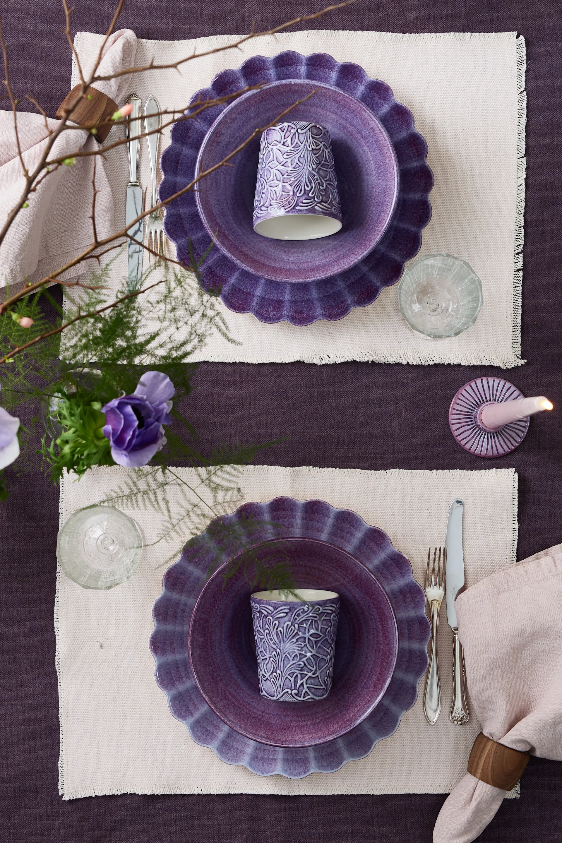 Two opposing table settings in purple, focussing on the Lace cup from Mateus.