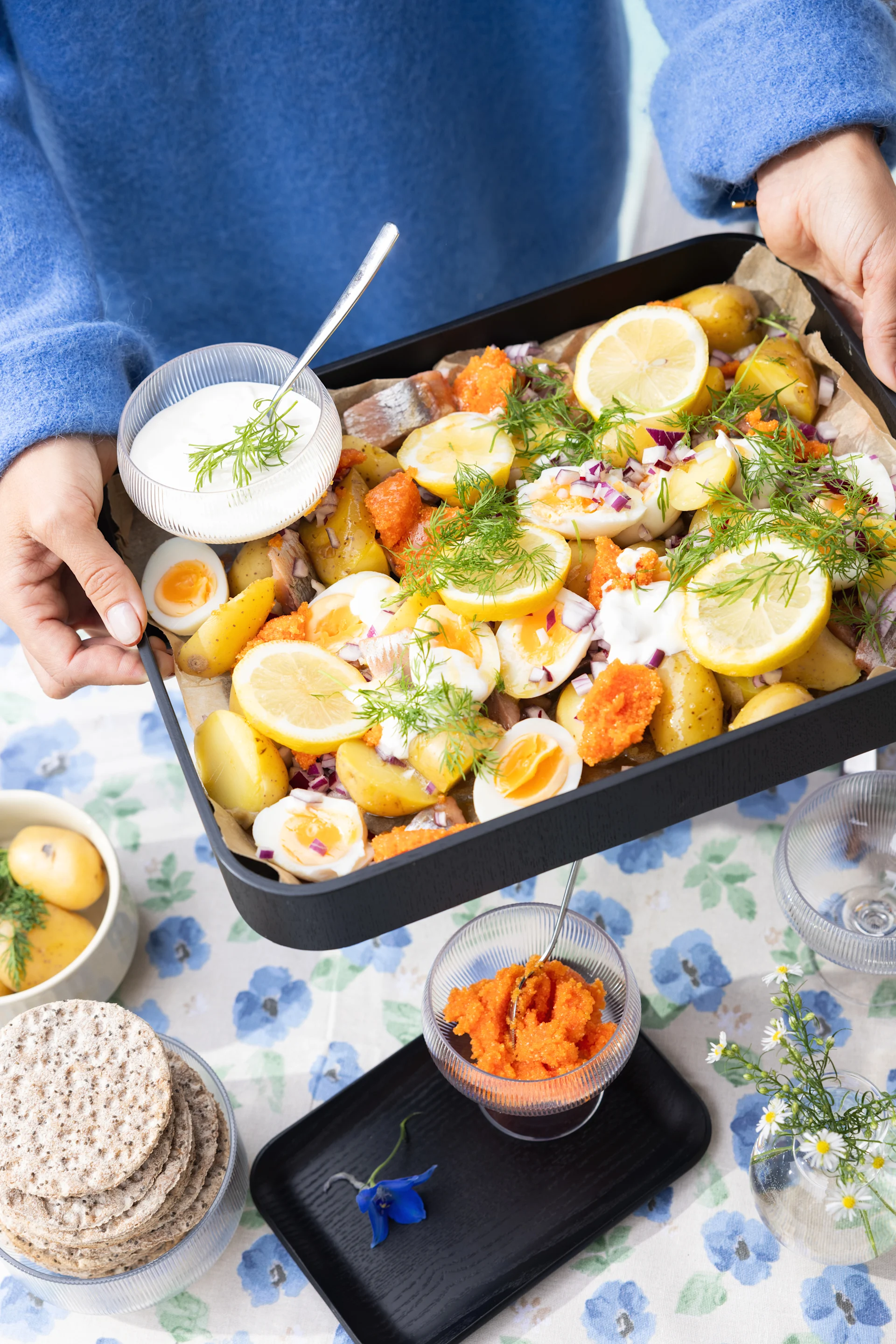 Discover summer recipes like the one you see here with potatoes, dill, lemon and cured herring. 