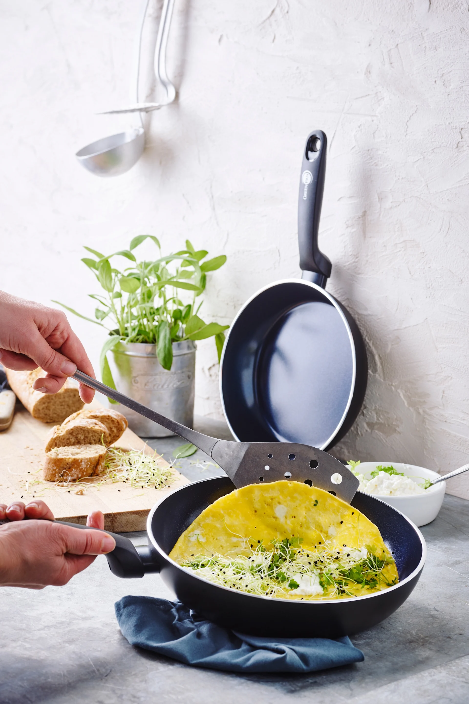An omelette is made in the non-stick coated Torino pan set from GreenPan.