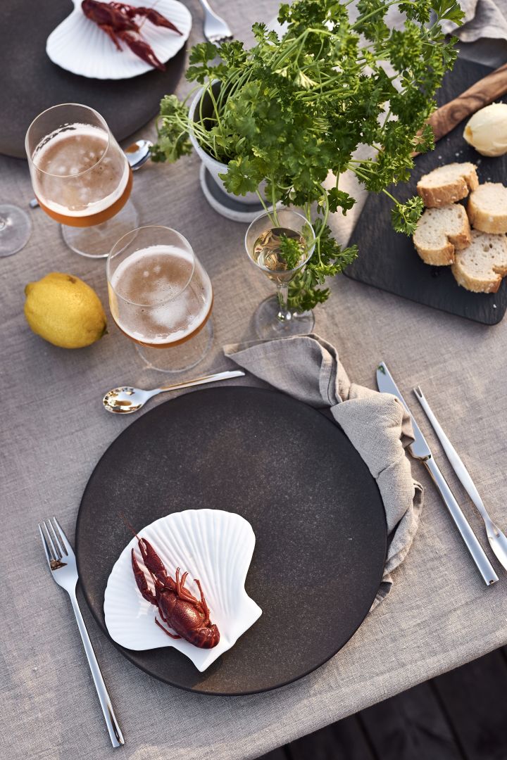 Host a Swedish crayfish party and use details from the sea to set the table like this shell plate for Byon, what could be more perfect for a seafood party?