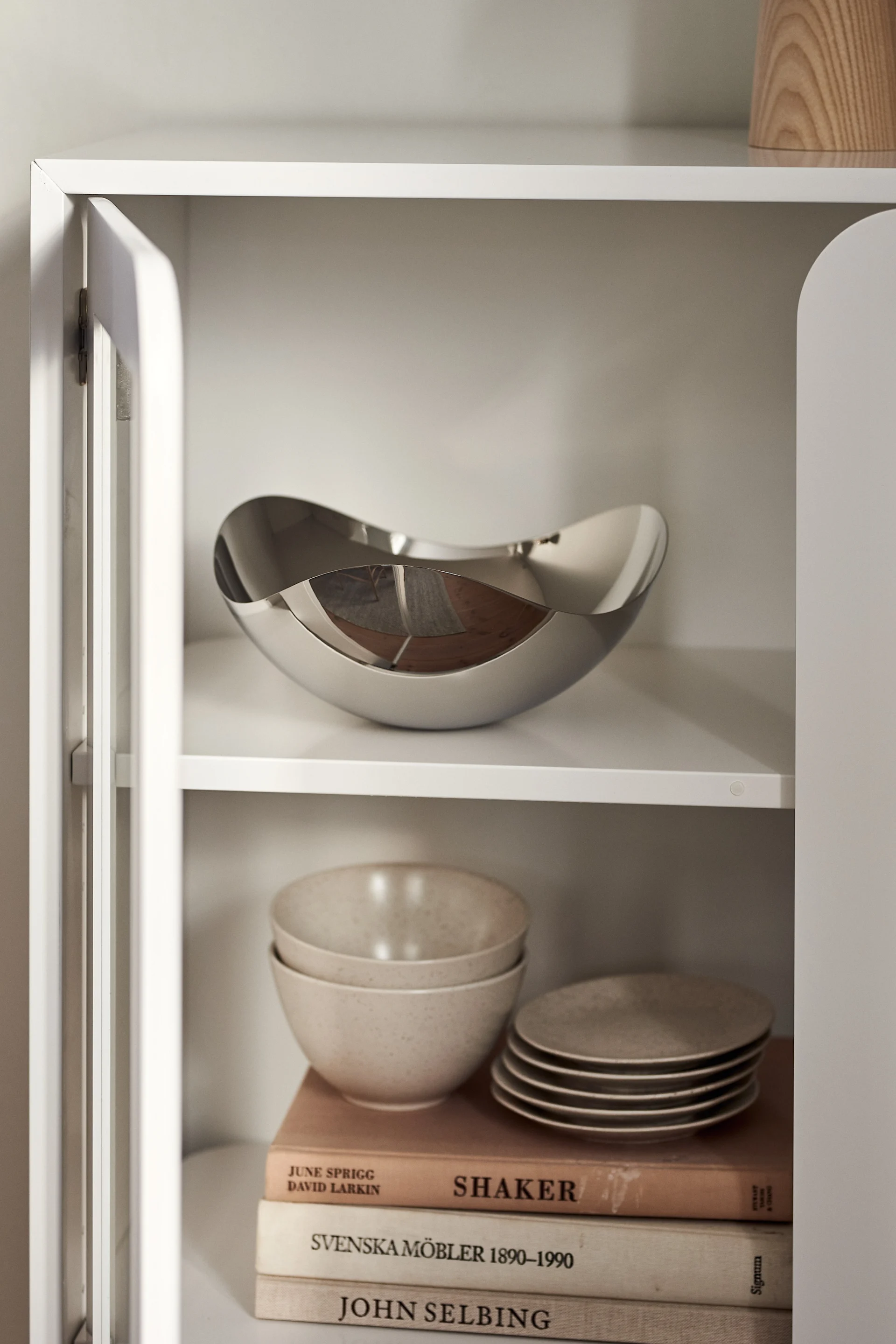 The Bloom serving bowl displaying in a glass fronted cabinet makes the perfect anniversary gift idea for couples who love to display art in their homes.