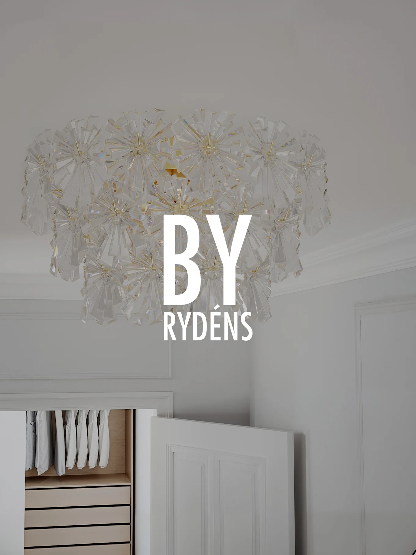 Large, ornate crystal ceiling light fixture with clear faceted pieces forming a spiky, starburst design.