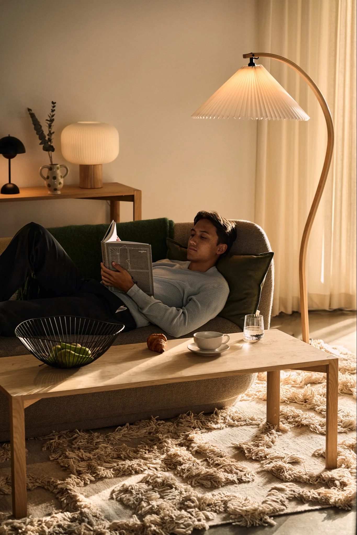 When planning your lighting consider multiple light sources in each room. Here you see a living room with the Gubi floor lamp and the Scandi Living Fair and the &Tradition Flowerpot table lamps.