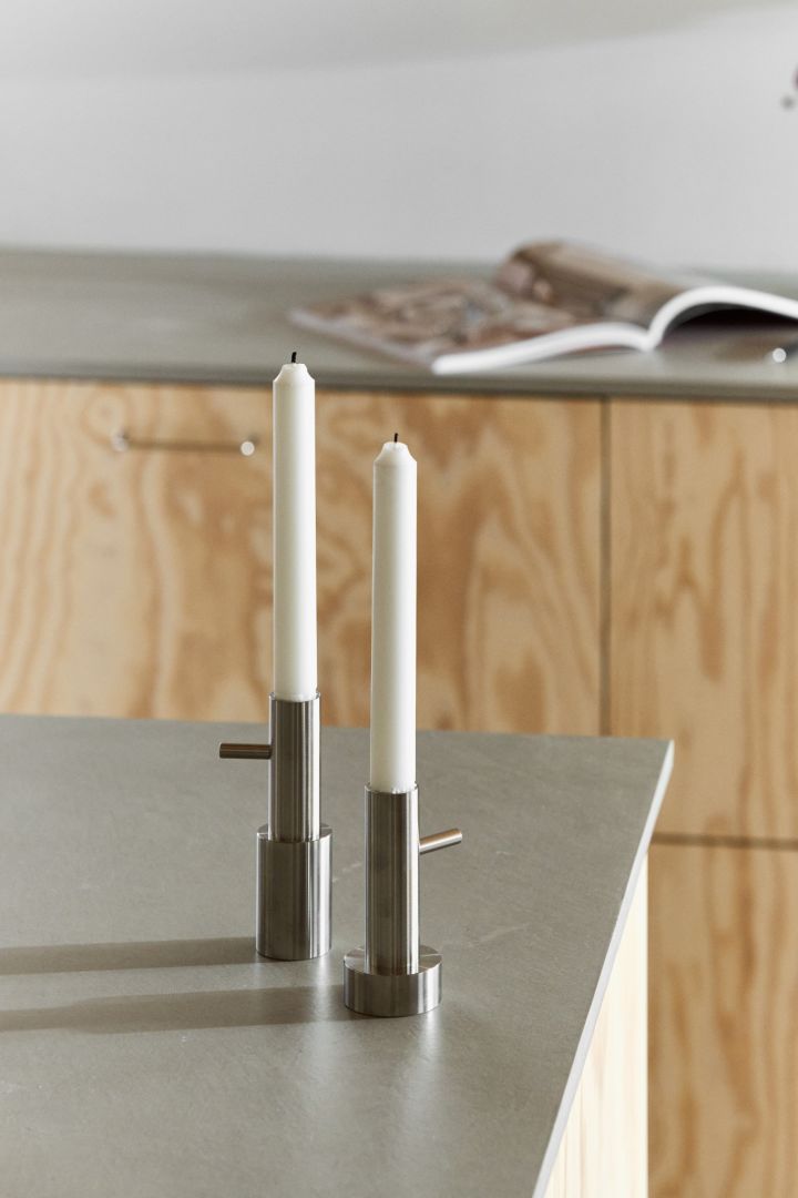 Here you see two single Jaime Hayon candle holders, for Fritz Hansen, standing on a kitchen side.