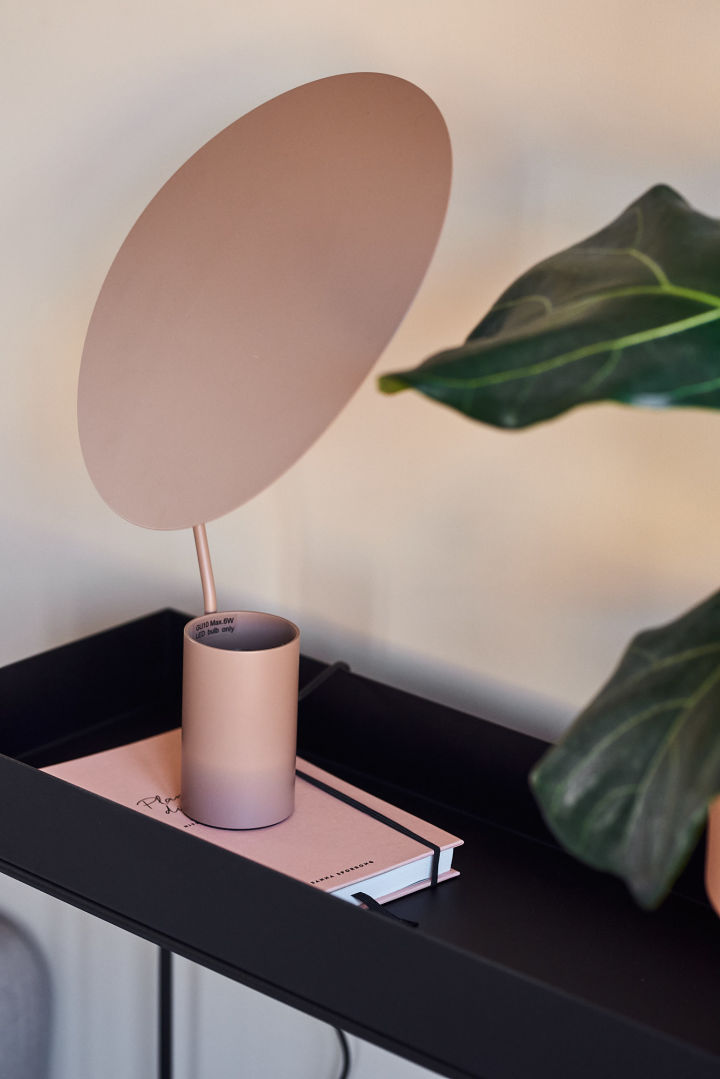 Ombre table lamp in a warm pink tone.