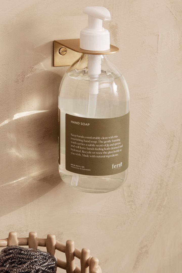 Storage ideas for small bathrooms - here you see the wall mounted soap holder from Ferm Living, hang things on the wall to keep the counter space free from clutter. 