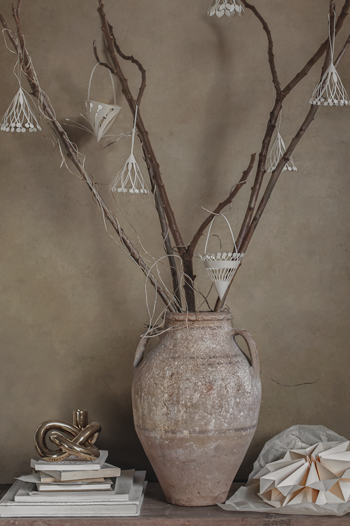 Sheer paper decorations that resemble small crafts continue to be popular among this year's Christmas decor trends for 2022 - here at Ferm Living.