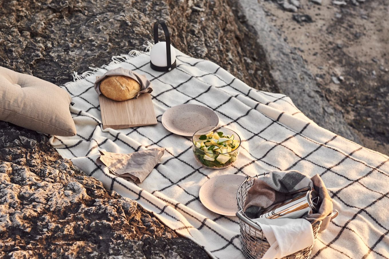 Enjoy a picnic on the beach at sunset with the carrie lamp from Audo Copenhagen.