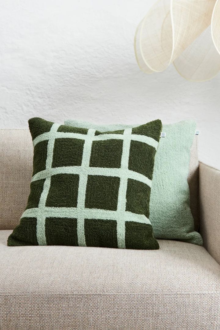 Large squares also appear on textiles, such as this Check cactus-green-aqua cushion cover from Chatwal & Jonsson.