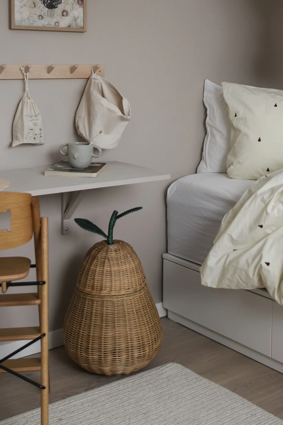 Adorable accessories for the children's room like this wicker pear shaped basket are both playful and practical.