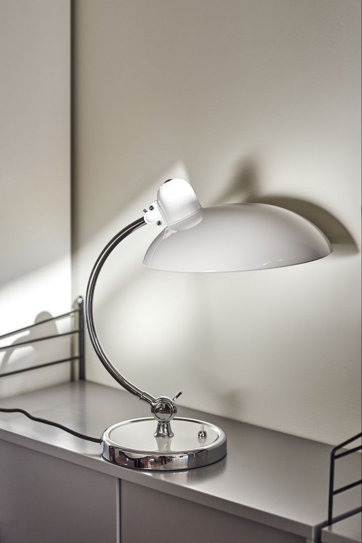 White table lamp from Fritz Hansen with chrome details. 