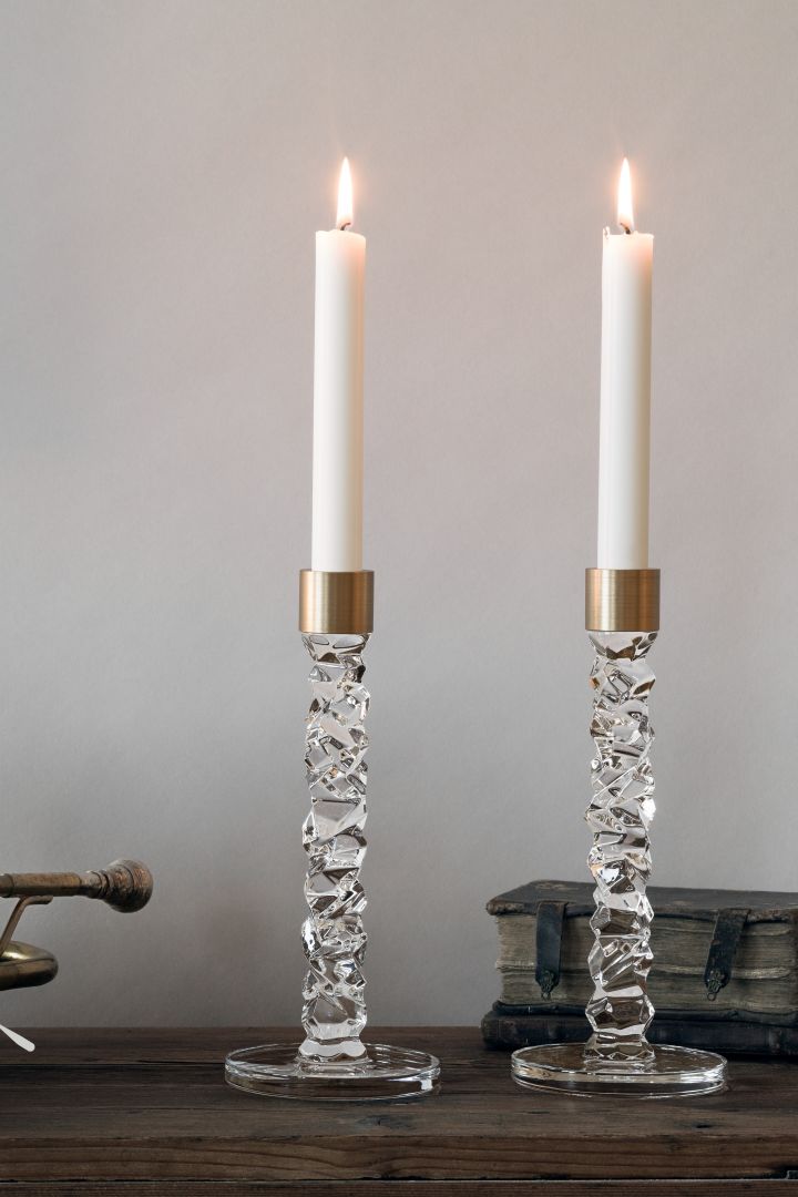 These elegant crystal glass candle holders from Orrefors are the perfect anniversary gift idea for couples who love Scandinavian interior design. 
