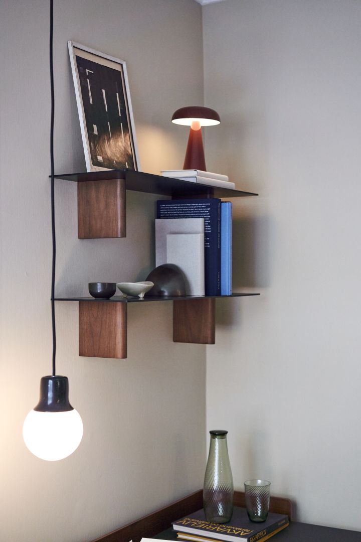 Decorate your small home office with shelving and simple lighting solutions like here with the portable Como table lamp from &Tradition.