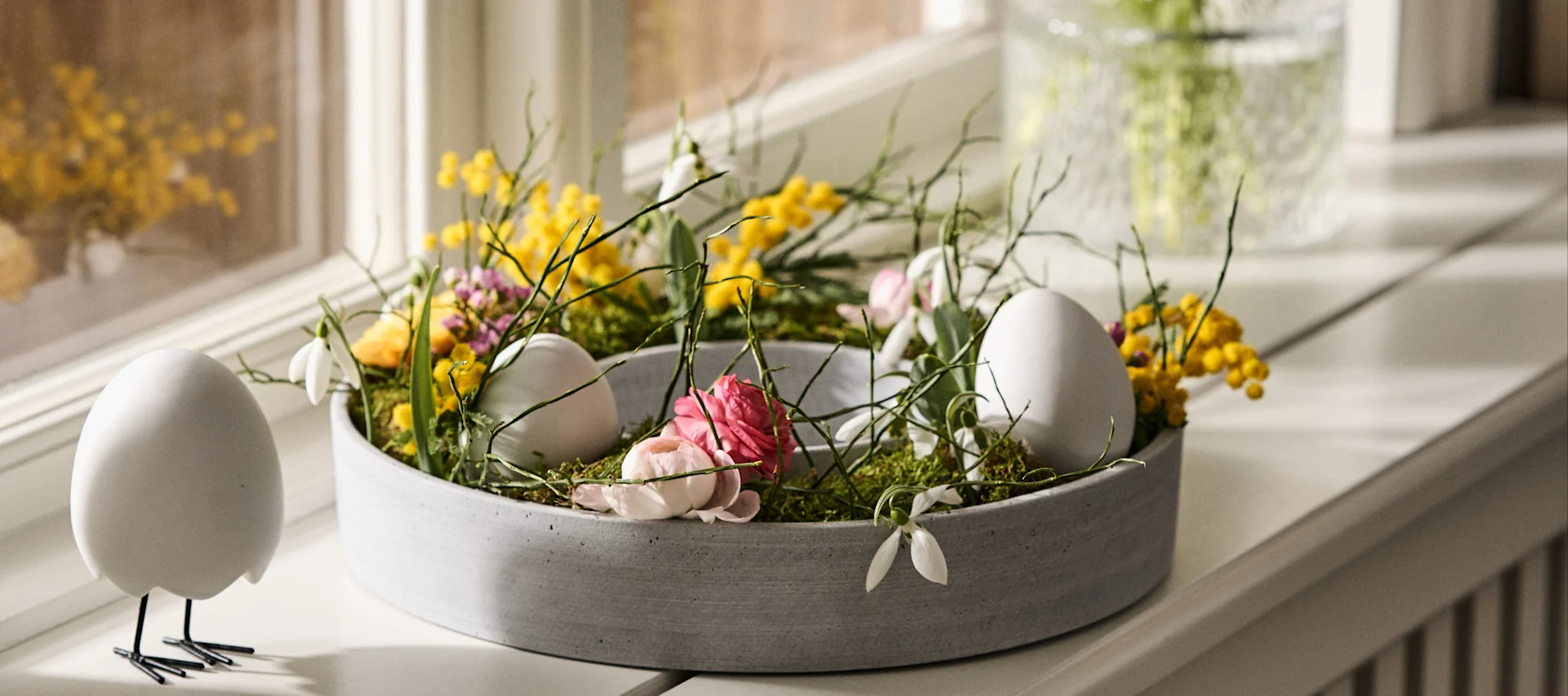 The Easter wreath in The Ring candle holder from House Doctor is a simple Easter craft that will decorate any windowsill.