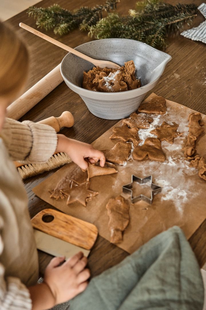 Scandinavian lifestyle ideas for you to try this winter - little girl prepares pepparkakor. 