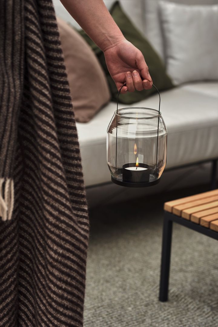 Cosy patio decor ideas - Create a cosy patio by decorating your patio with cozy lighting such as candles in the Ernst candle lantern that you can take with you everywhere.
