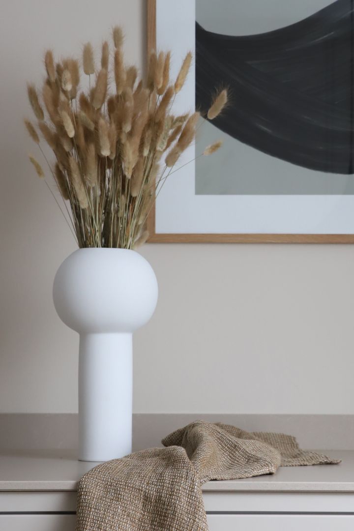 The white pillar vase from Cooee Design with dried reeds. 