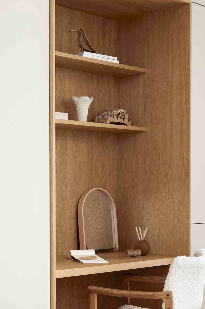 Items from Cooee’s Woody collection in a wooden set of shelves. Here you see the Bird Woody and the Woody mirror.