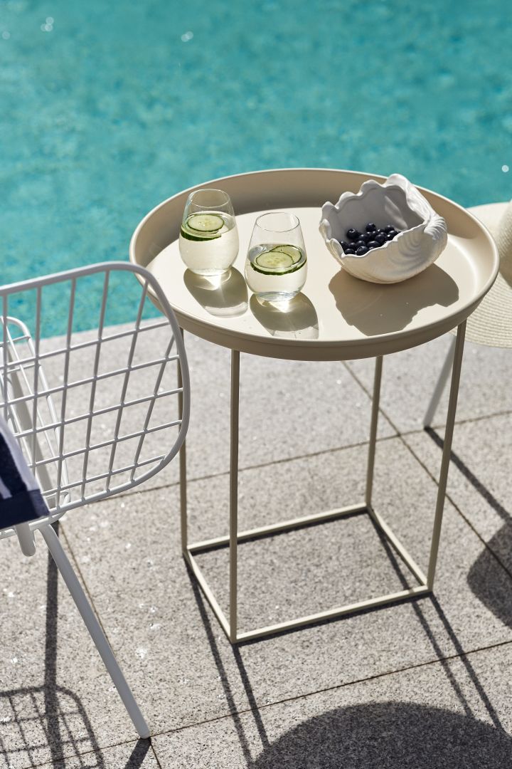 Cosy patio decor ideas - Create a cosy patio by furnishing it with a stylish and practical tray table from NORR11 that can also be used as a tray as the top is removable.