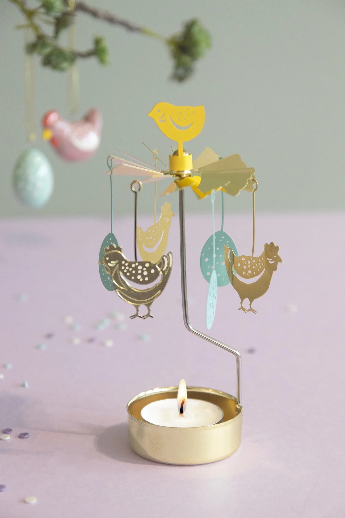 The Henhouse angel game from Pluto Design with Easter motifs stands on a table.
