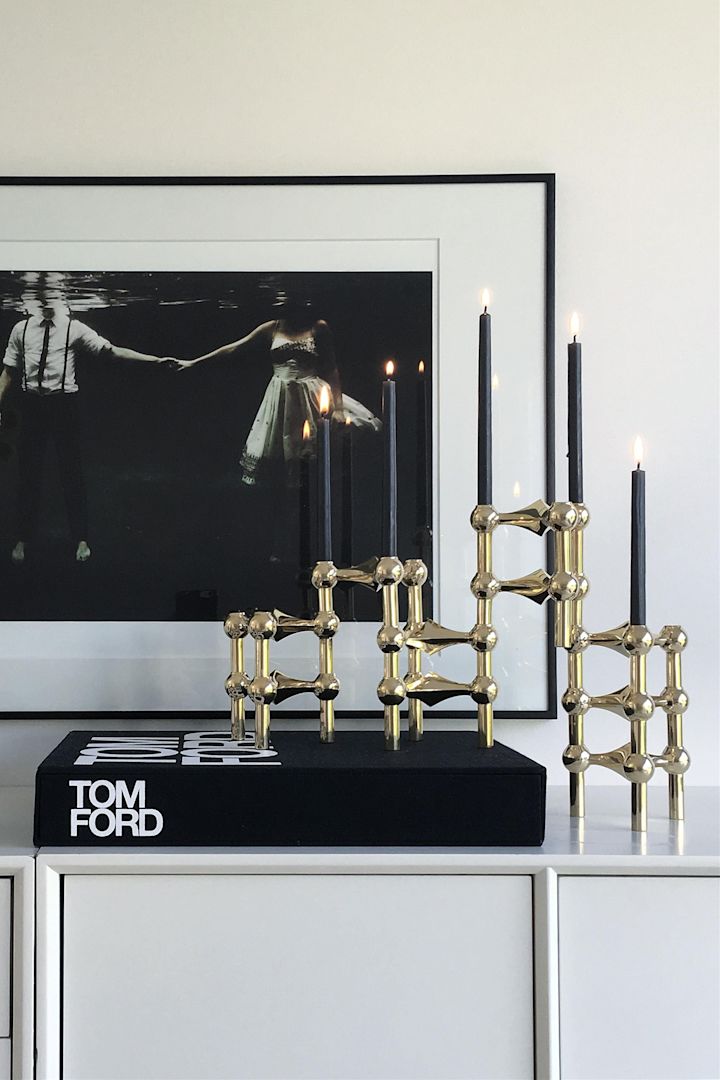 Here you see a collection of the Nagel candle holders from STOFF stacked on a side table - the perfect anniversary gift idea for a couple celebrating their Golden wedding anniversary. 