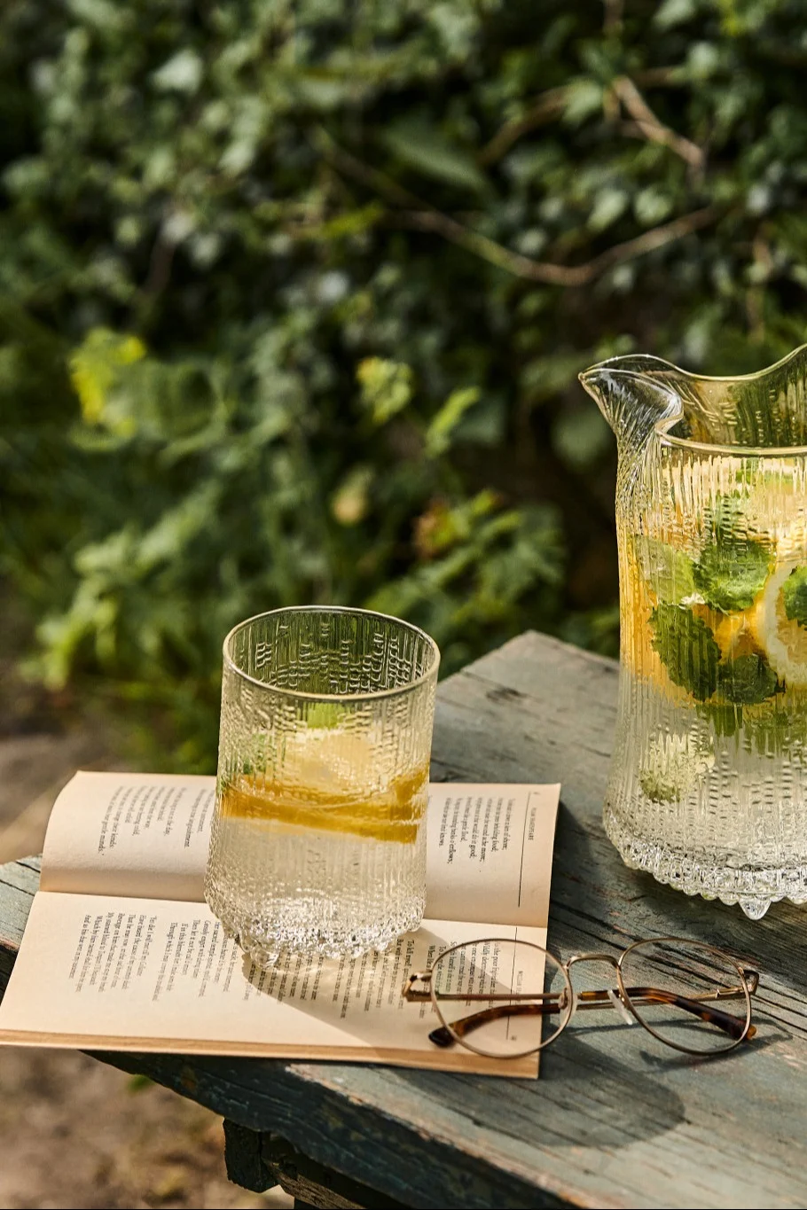 Summer Breeze is a lemon and mint mocktail served here in the garden in an Ultima Thule highball glass from Iittala.