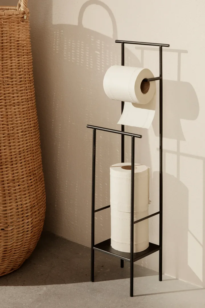 Storage ideas for small bathrooms - here you see the Dora toilet roll holder from ferm LIVING with storage for extra rolls. 