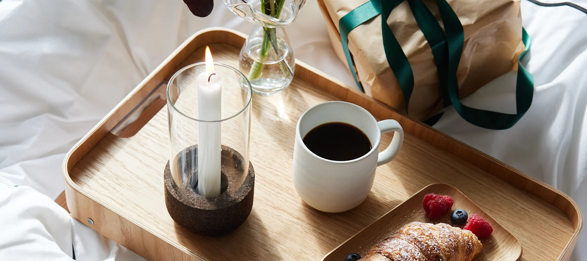 A couple share a dessert and a cocktail from the Hay Italian Ice Cream cup and the Essence Cocktail glass on Valentine's day. 