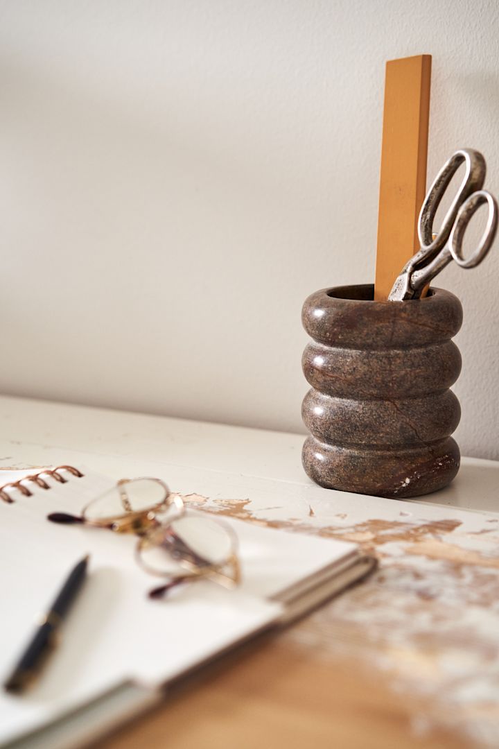 Practical details for your small home office like this Toothbrush holder from Ferm Living can double as a pen holder and keep all of your essential items close at hand.