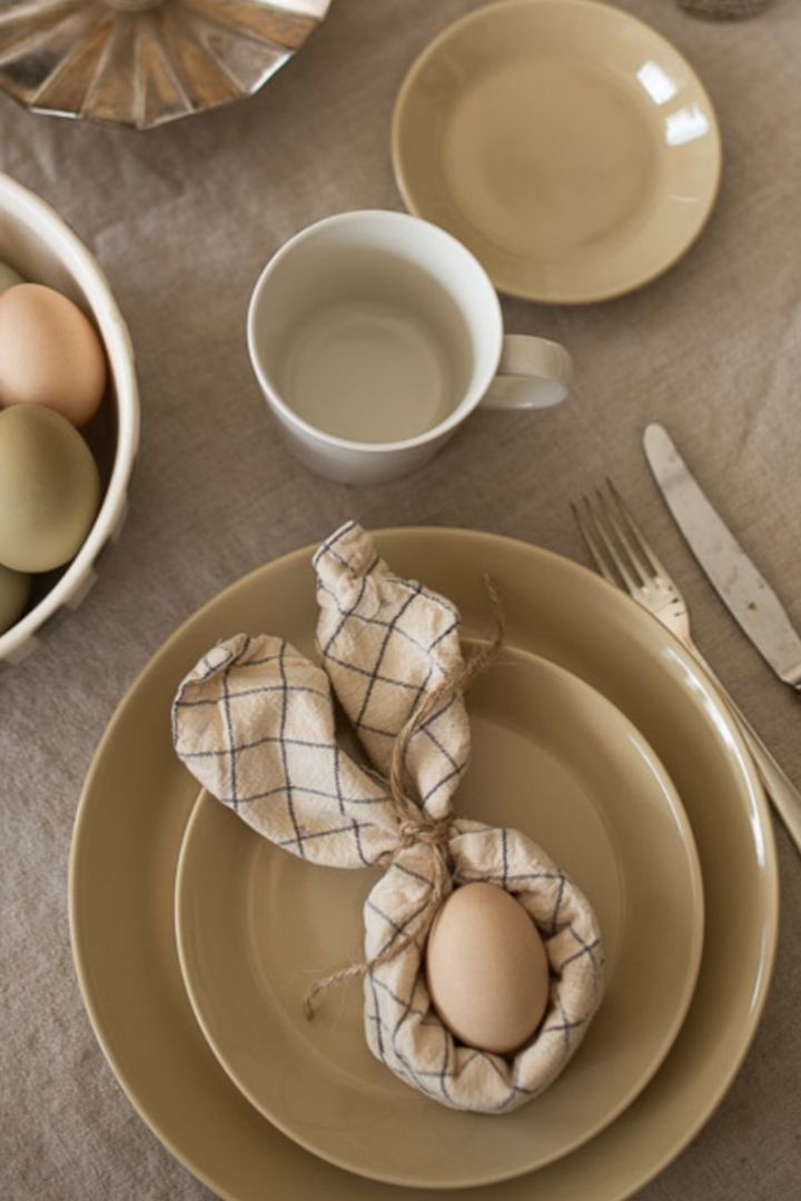 Fold your napkin into bunny ears for a lovely Easter table setting idea for your Easter table. 