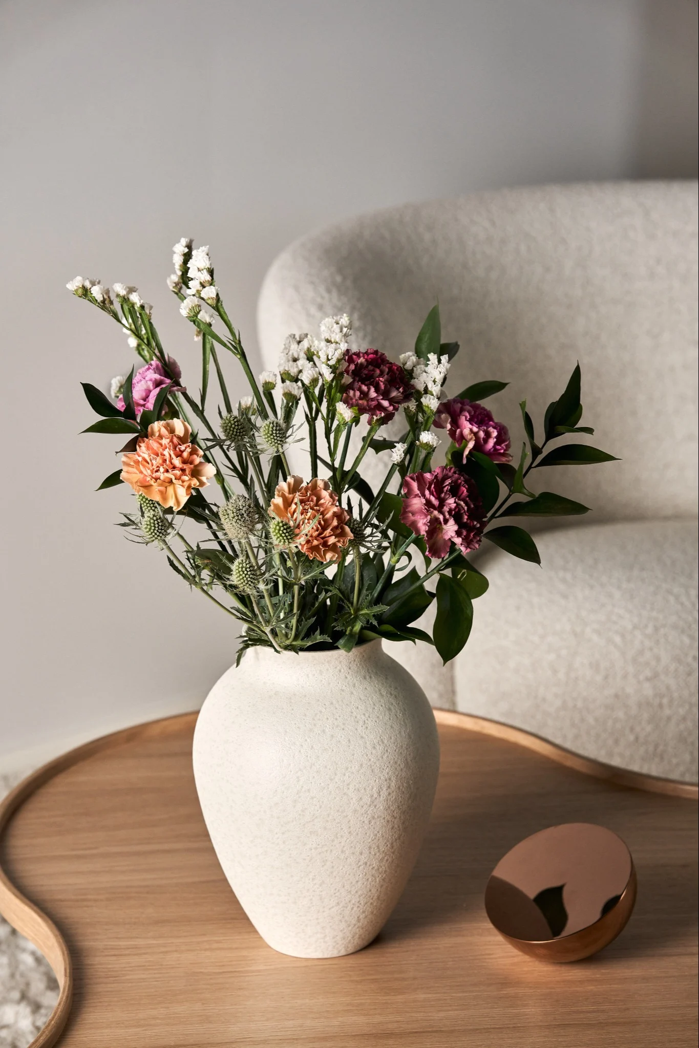 The best vase for tall stemmed flowers is a tall narrow vase like this Knabstrup vase from Knabstrup Keramik.