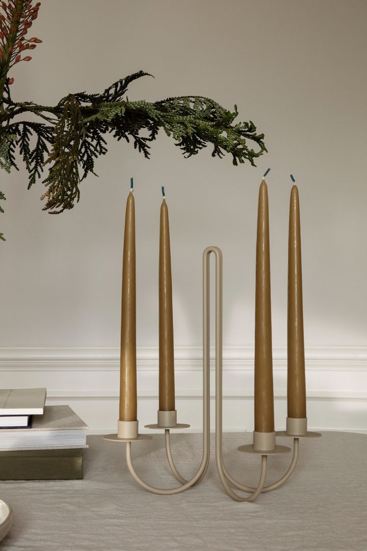 A candelabra in a warm shade of beige and a nostalgic retro design from ferm living is one of the Scandi Christmas decorations for 2022.