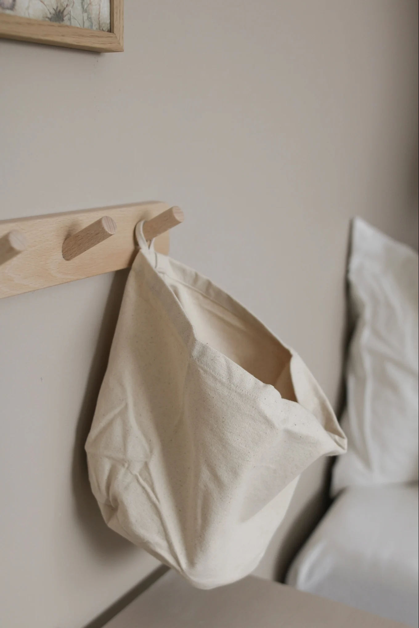 Practical storage accessories are perfect for your children's room, like these hooks and practical storage bag from Kid's Concept.