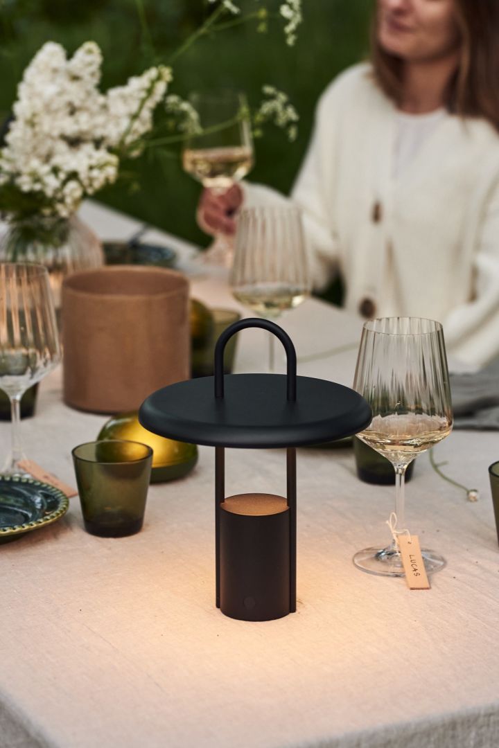 The Pier LED portable lamp from Stelton is a cordless table lamp that looks perfect on the set table for a dinner outside. 
