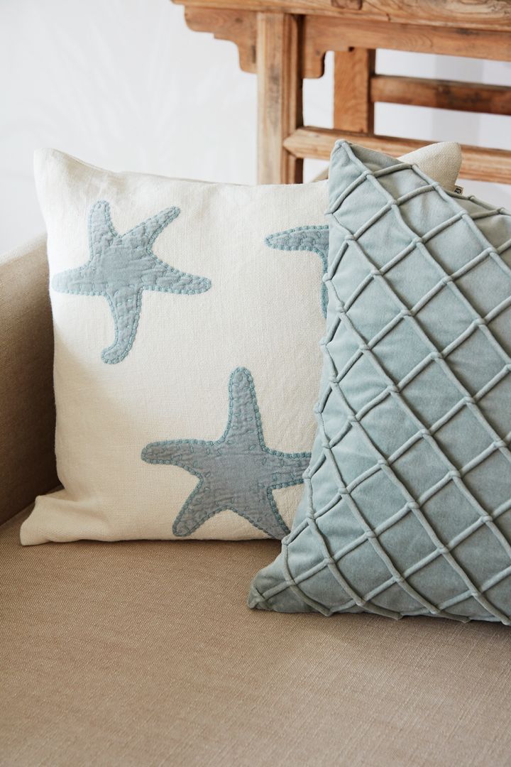The Star Fish cushion cover next to the Deva cushion cover in blue from Chhatwal & Jonsson brings to mind the Mediterranean sea.