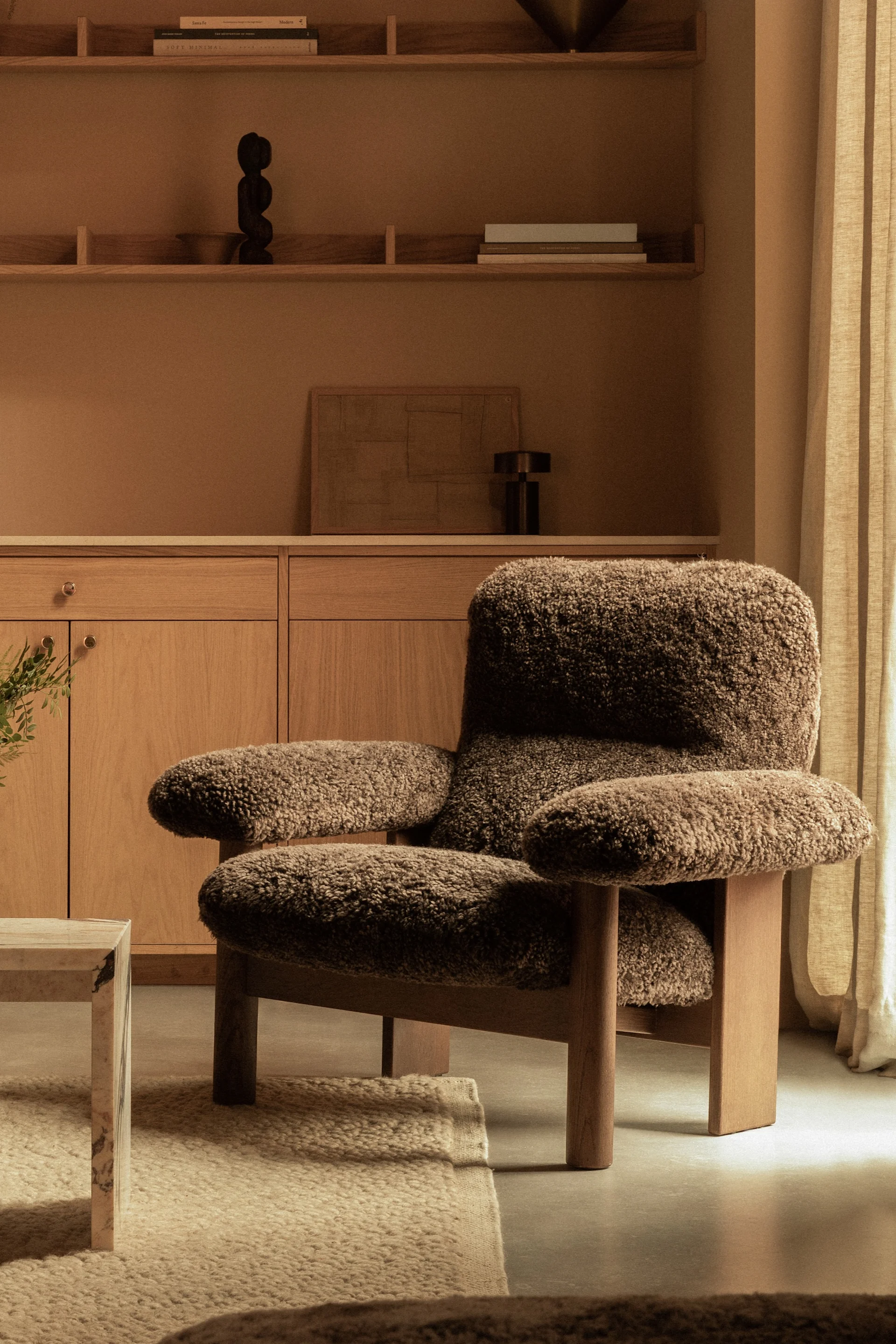 Chunky furniture is a big part of this year's Scandinavian interior design trends 2025 - here the Brasilia armchair from Audo Copenhagen, in brown sheepskin.