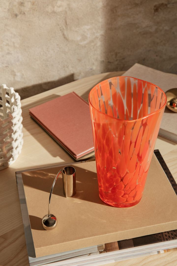 Burnt tones of orange and red will be big in our interiors in 2022 - seen here on the Casca vase from Ferm Living.