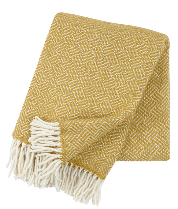 The Samba wool throw from Klippan Yllefabrik for a pop of colour in your cosy dining area. 