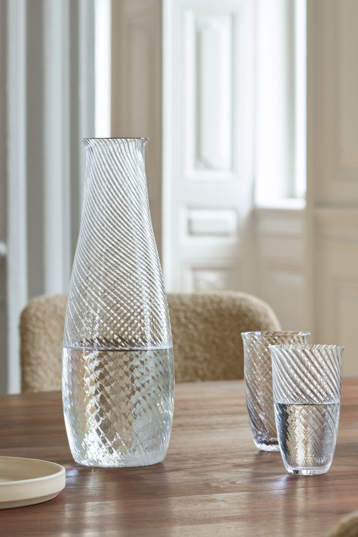 Fluted glass is one of this year's trends. The Collect glasses and decanters from &Tradition are elegant details on the set table.