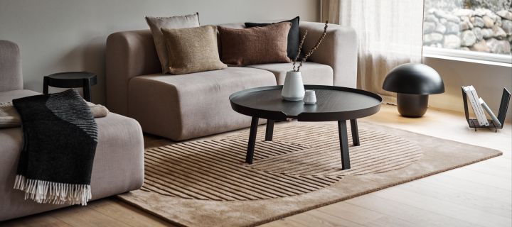 Decorate your living room with these cosy rug ideas - here you see the circles wool rug from the Levels collection from NRJD.