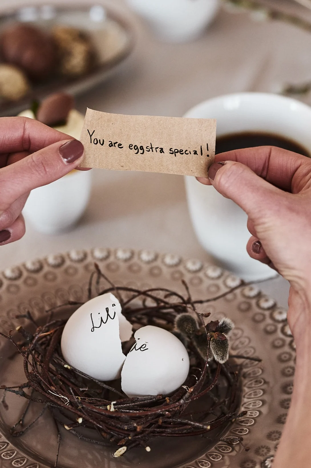 Make place cards in the shape of blown-out eggs and hide a loving message for your guests inside.