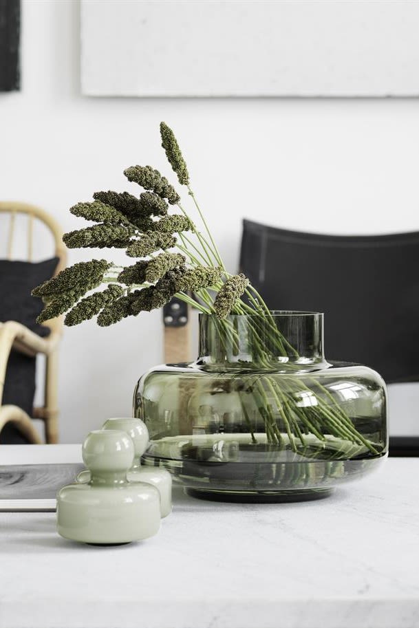 Be inspired by nature and jump on board one of the top autumn interior design trends in 2021. Add some greenery to your home. Here you see green Urna vase from Marimekko.