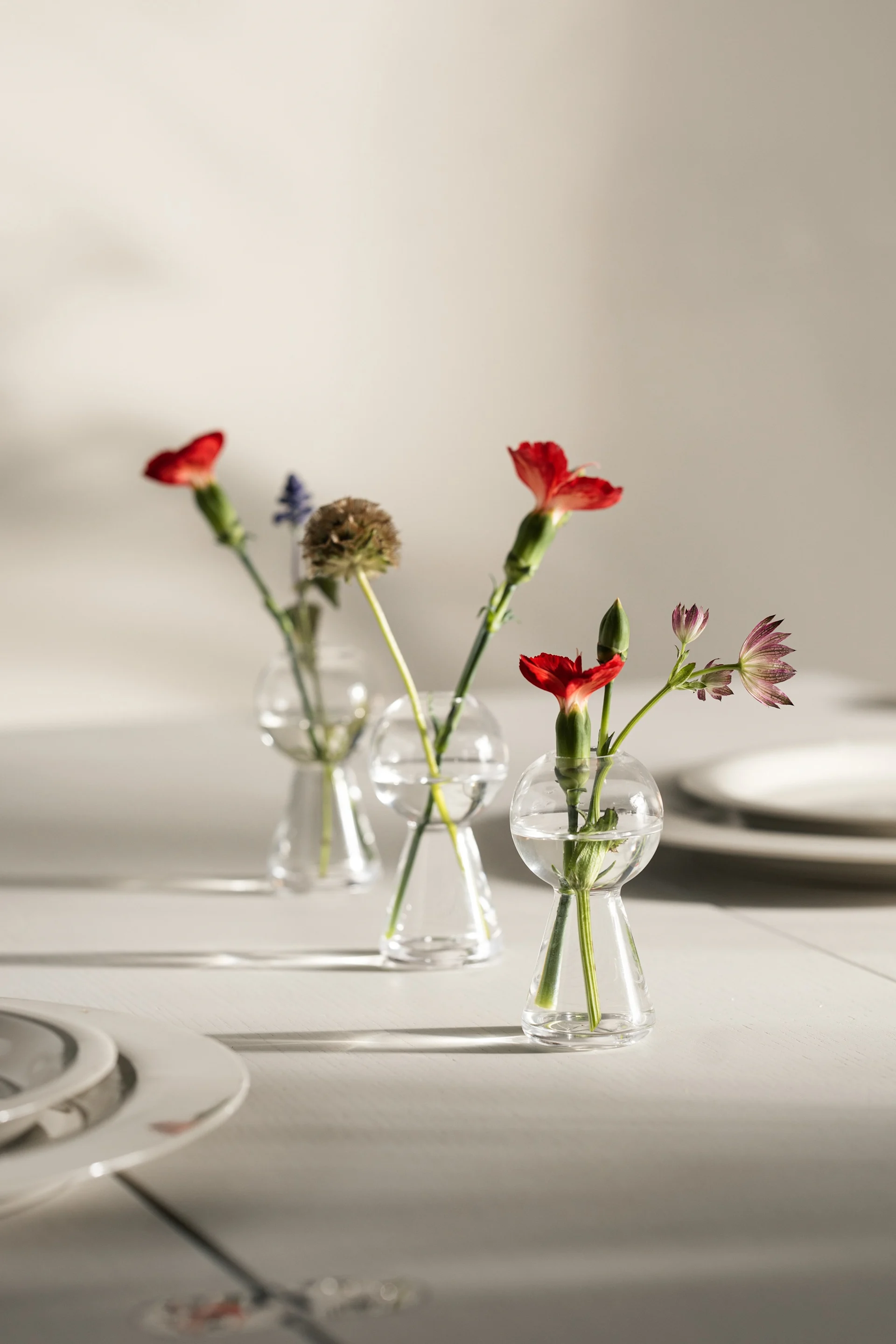 The best vase for small or individual flowers like the flower vase from Marimekko in olive green. 