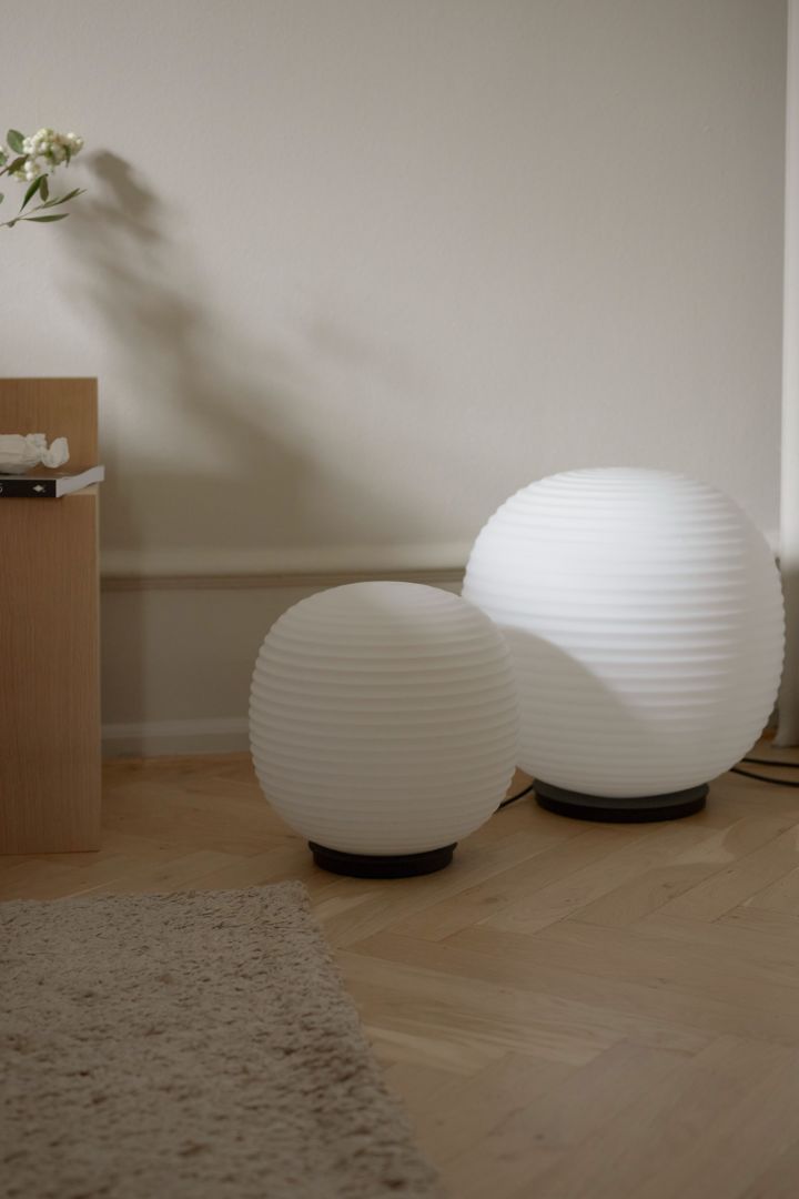 Statement interior design is one of the interior design trends for spring 2022 that you can see reflected in these unique Lantern Globe lamps from New Works in white.