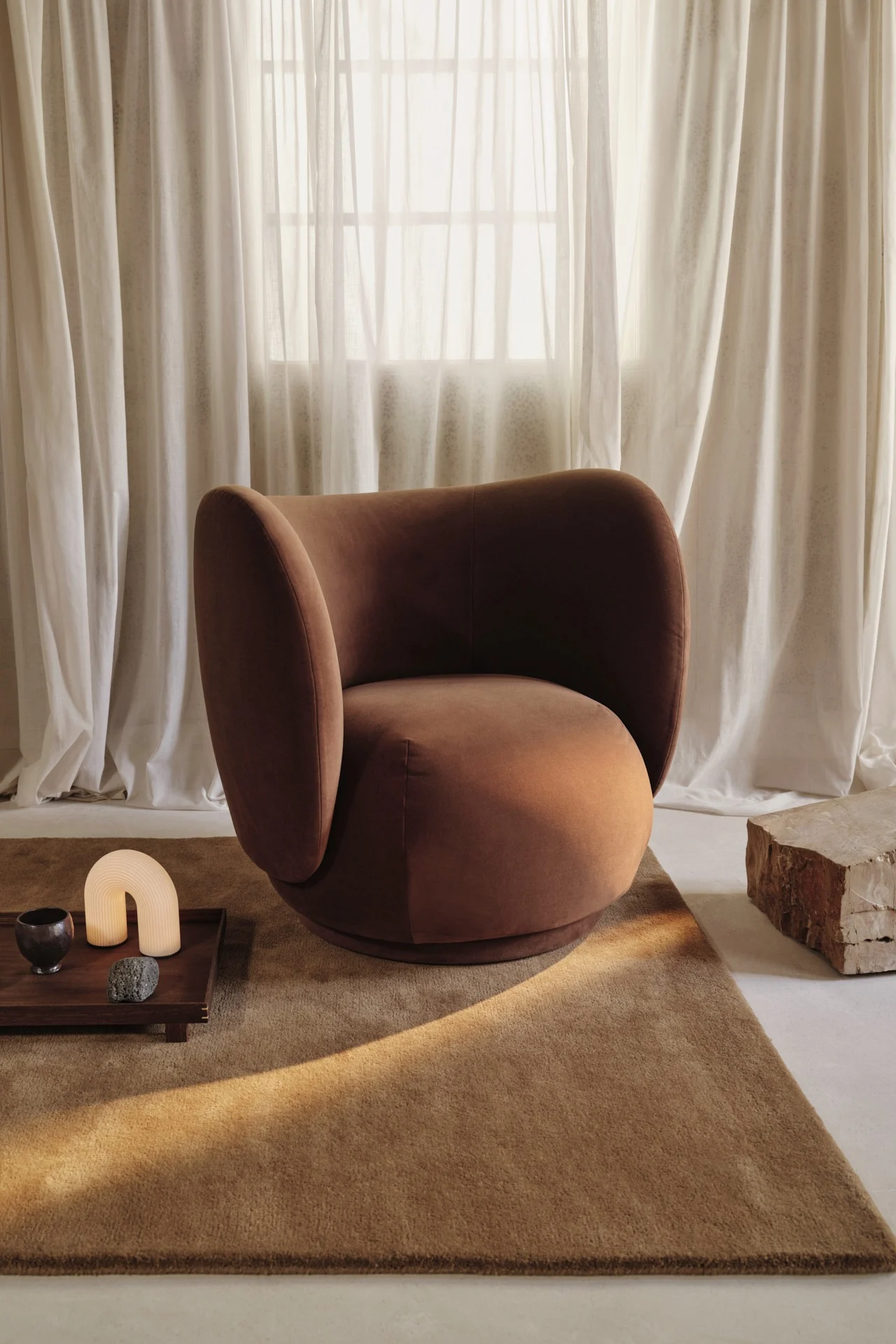 Kombucha, the light brown shade featured among the colour trends of 2026, is shown here on the Rico armchair from Ferm Living.