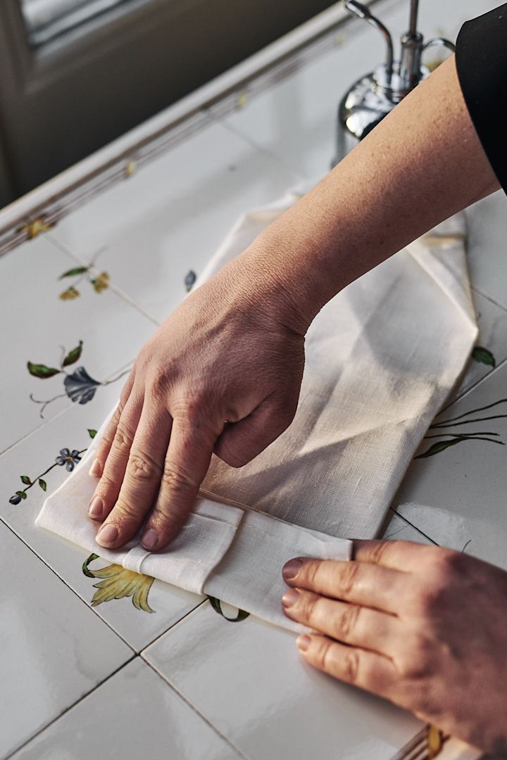 Napkin folding ideas - step 6 in folding a stylish shirt. 