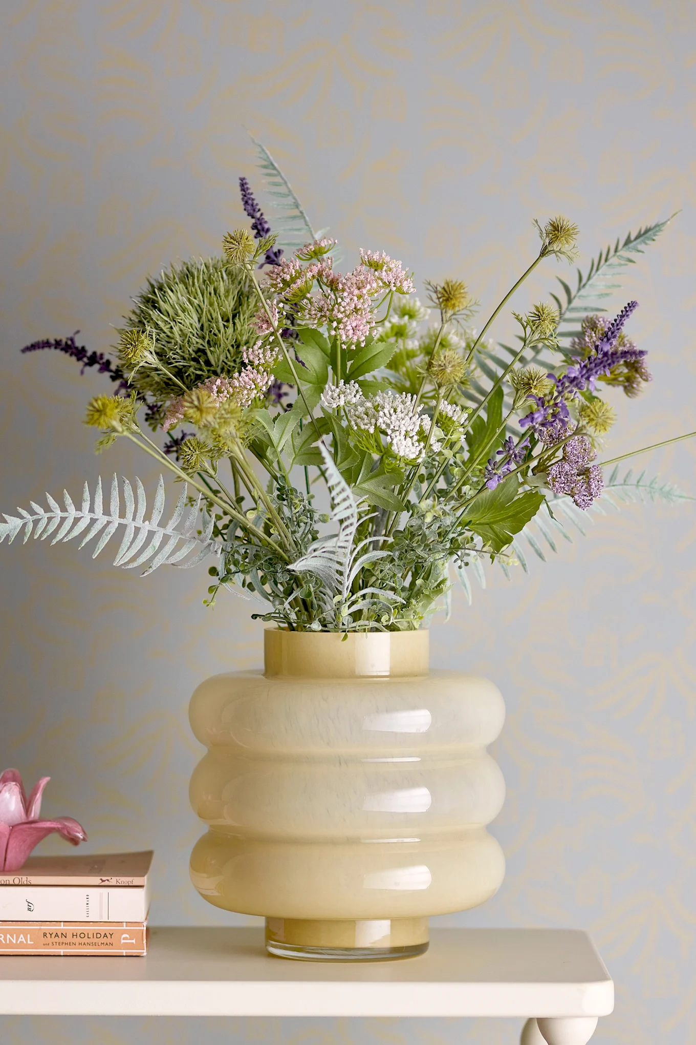 A yellow vase that reflects one of the leading color trends in interior design for 2026.