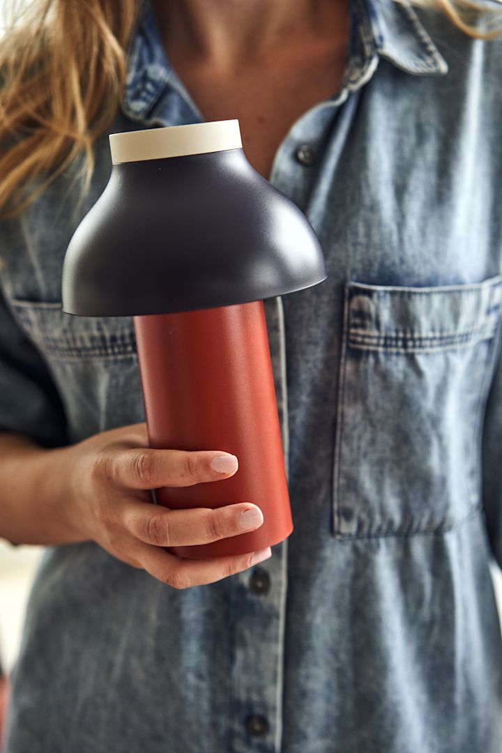 A red and blue portable lamp from HAY works perfectly as one of the Scandinavian interior design trends for 2023.